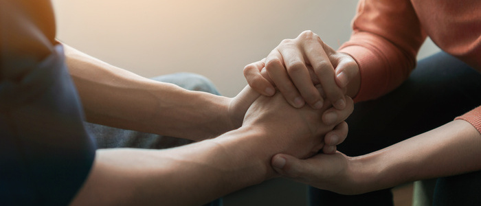 PTSD Mental health concept, Psychologist sitting and touch hand